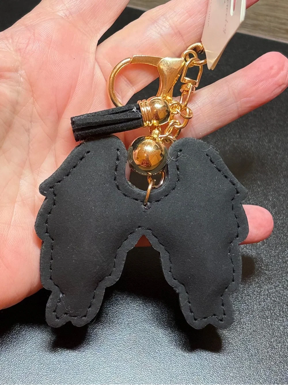 Gold-Tone Iridescent Crystal Angel Wing Keychain with Black Tassel